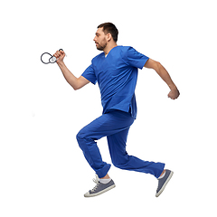 Image showing doctor or male nurse with stethoscope jumping