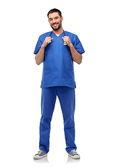 Image showing smiling doctor or male nurse with stethoscope