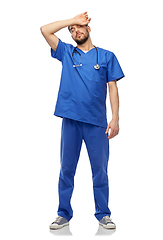 Image showing tired doctor or male nurse with stethoscope