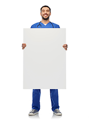 Image showing smiling male doctor or nurse with big white board