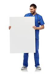 Image showing smiling male doctor or nurse with big white board