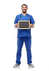 Image showing male doctor or nurse with chalkboard