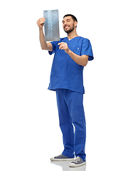 Image showing happy smiling doctor or male nurse with x-ray