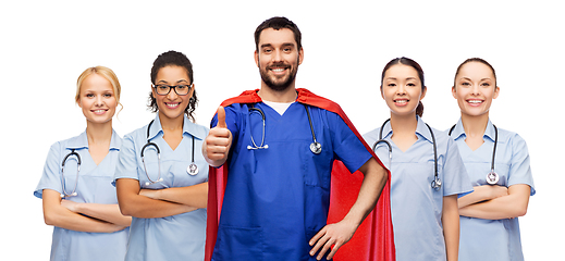 Image showing happy doctor or nurse in superhero cape with team