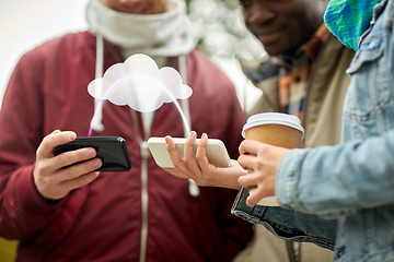 Image showing friends transfering data from smartphones