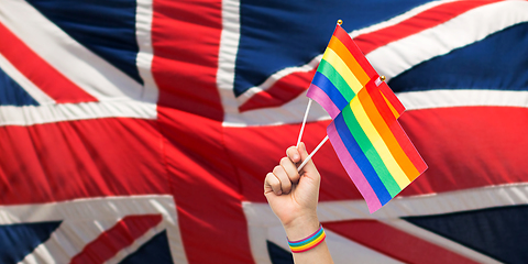 Image showing hand with gay pride rainbow flags and wristband