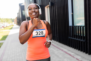 Image showing happy african american woman running marathon