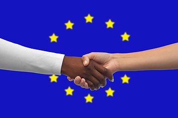 Image showing handshake over flag of european union