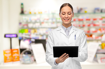 Image showing female doctor with tablet pc at pharmacy