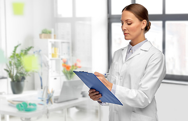 Image showing female doctor with clipboard at hospital