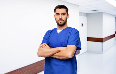 Image showing doctor or male nurse in blue uniform