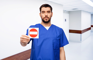 Image showing doctor or male nurse showing stop sign