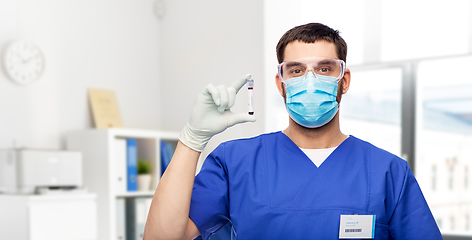 Image showing male doctor in mask with blood in test tube