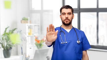 Image showing doctor or male nurse showing stop gesture