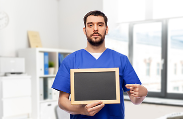 Image showing male doctor or nurse with chalkboard