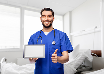 Image showing male doctor with tablet pc showing thumbs up