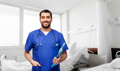 Image showing smiling doctor or male nurse with folder