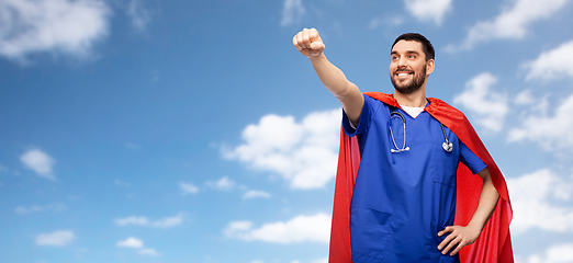 Image showing smiling doctor or male nurse in superhero cape