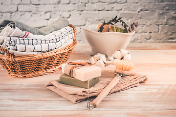 Image showing Handmade natural bar soaps and cotton towels. Ethical, sustainable zero waste lifestyle