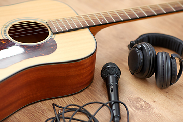 Image showing close up of guitar, microphone and headphones