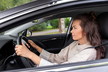 Image showing woman or female driver driving car in city