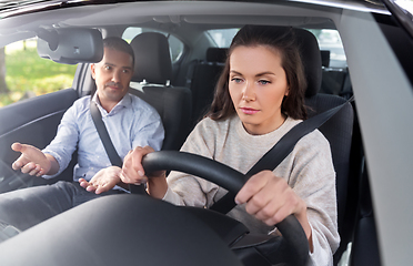 Image showing car driving school instructor teaching woman