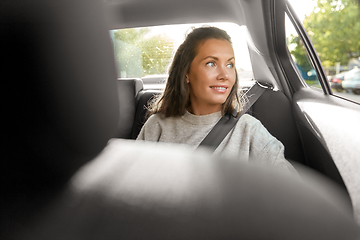 Image showing happy smiling woman or female passenger in car