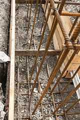 Image showing Reinforcement covered with earth during formwork collapse