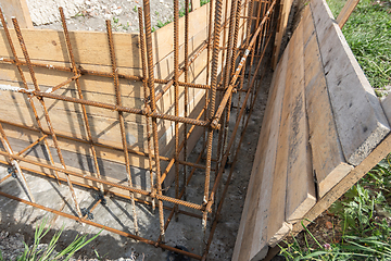 Image showing Installation of formwork during the construction of a strip, shallow foundation, close-up