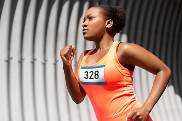 Image showing young african american woman running marathon