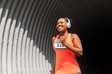 Image showing happy african american woman running marathon