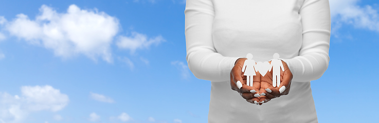 Image showing close up of african american woman holding couple