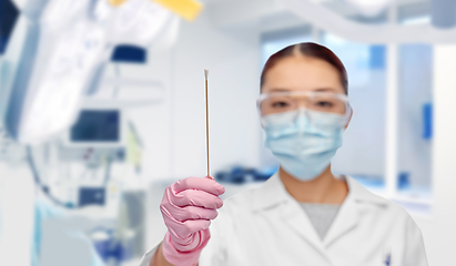 Image showing asian female doctor in mask with test cotton swab