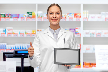 Image showing happy female doctor with tablet pc shows thumbs up