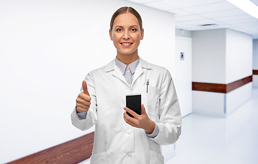 Image showing female doctor with smartphone showing thumbs up