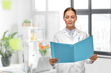 Image showing female doctor with folder at hospital