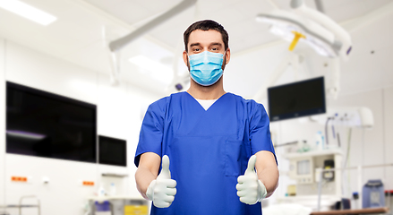 Image showing male doctor in mask showing thumbs up