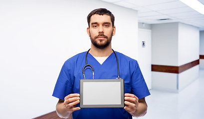 Image showing doctor or male nurse showing tablet computer