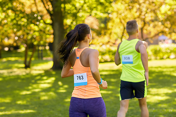 Image showing couple of young sportsmen running marathon