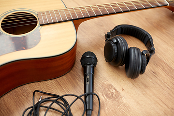 Image showing close up of guitar, microphone and headphones