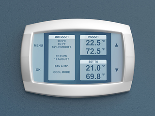 Image showing Smart thermostat on blue wall