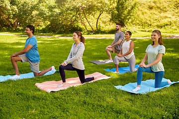 Image showing group of people doing yoga at summer park