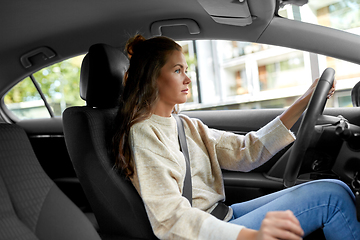 Image showing woman or female driver driving car in city