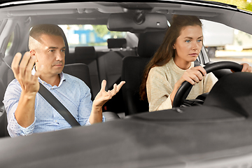 Image showing car driving school instructor teaching woman