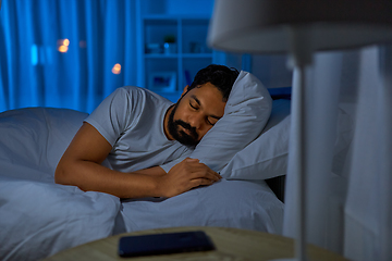 Image showing indian man sleeping in bed at home at night