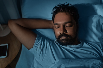 Image showing indian man sleeping in bed at home at night