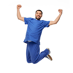 Image showing happy smiling doctor or male nurse jumping in air