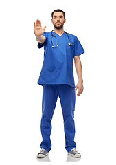 Image showing doctor or male nurse showing stop gesture