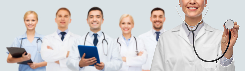 Image showing close up of smiling female doctor with stethoscope