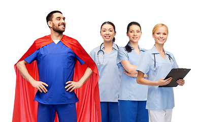 Image showing male doctor in superhero cape and female nurses